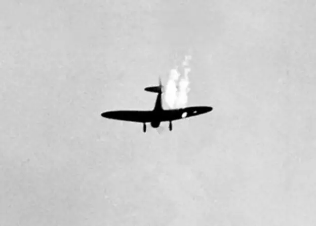 Aichi D3A1 Val dive bomber being shot down over Pearl Harbor on December 7, 1941