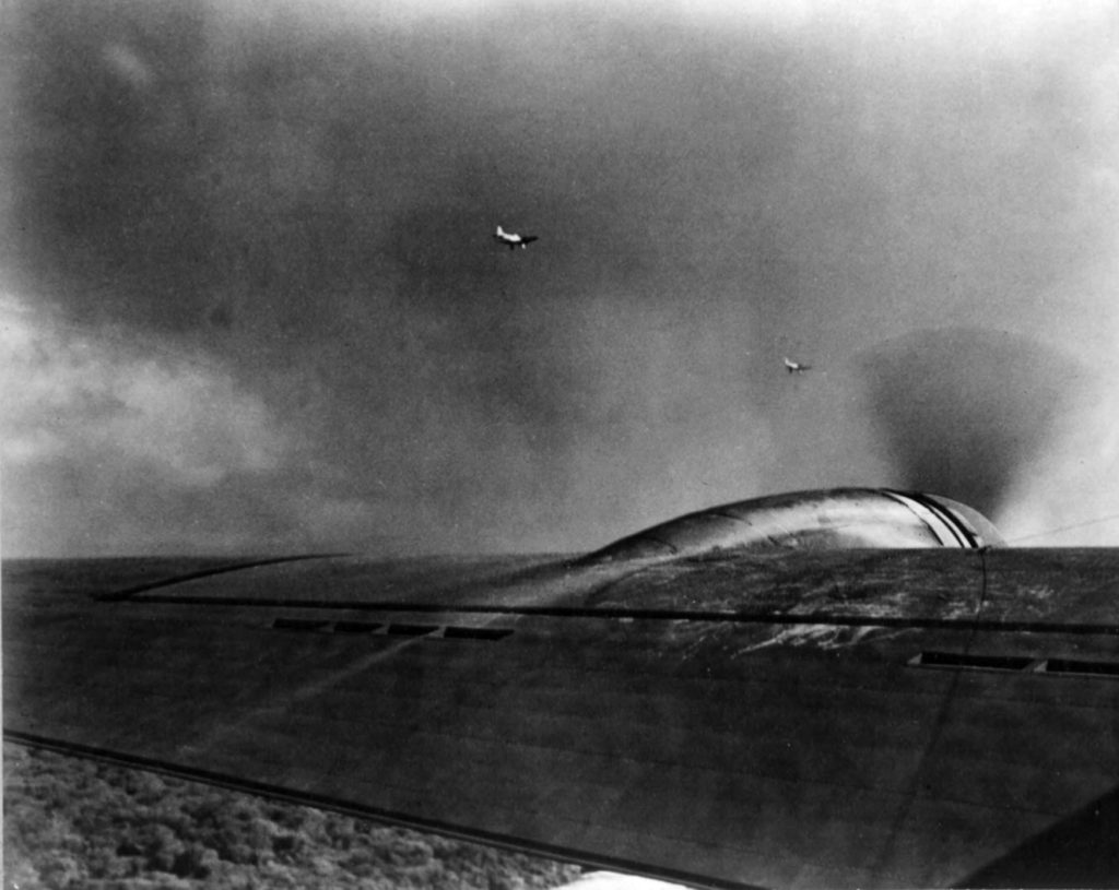 Two Aichi D3A1 Val dive bombers over Oahu during the Pearl Harbor attack, seen from a B-17