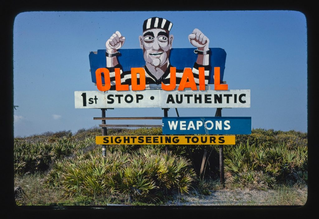 Vintage Old Jail attraction billboard in St. Augustine, Florida